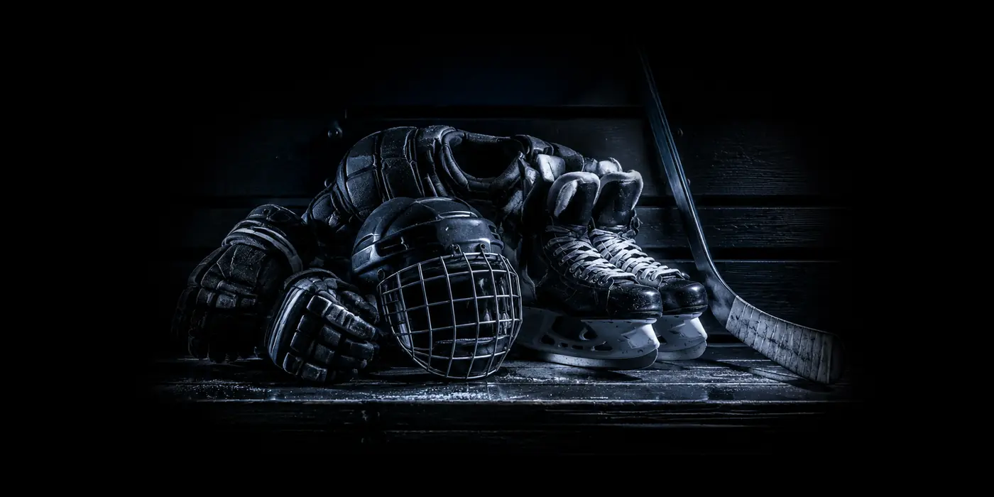 Hockey equipment arranged on a dressing-room bench