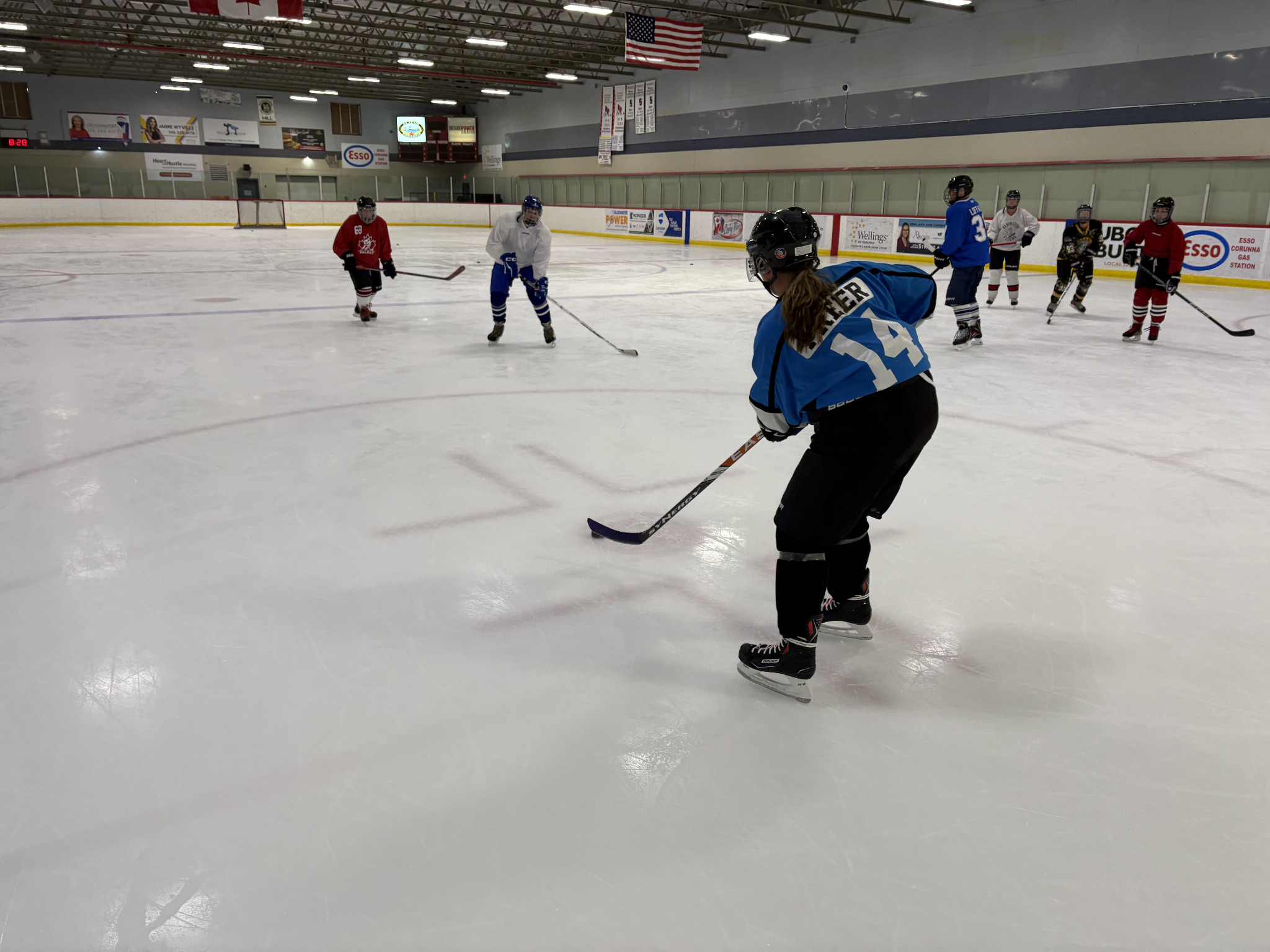 Never 2 Late Hockey players practicing on the ice