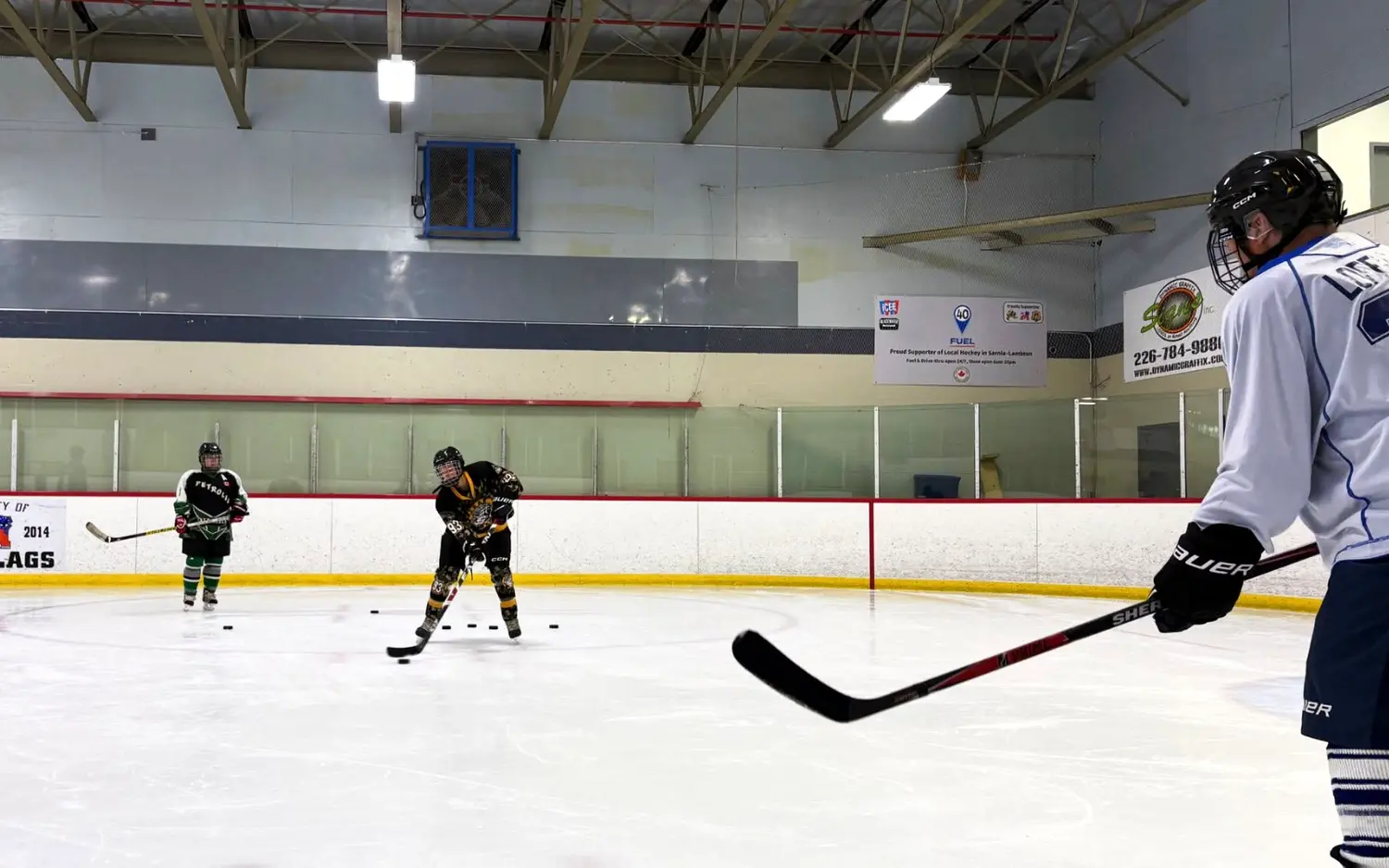 Participant handling pucks in a drill